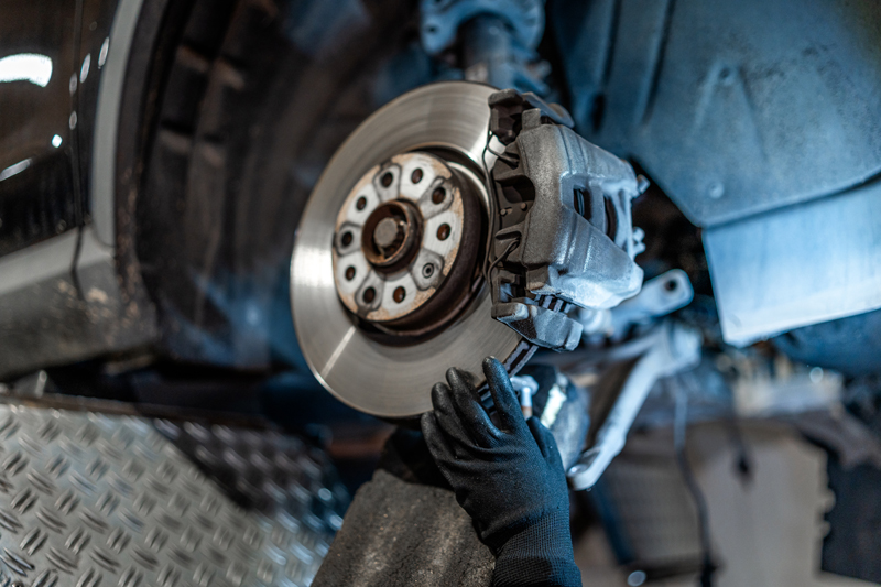 Technician servicing a brake rotor